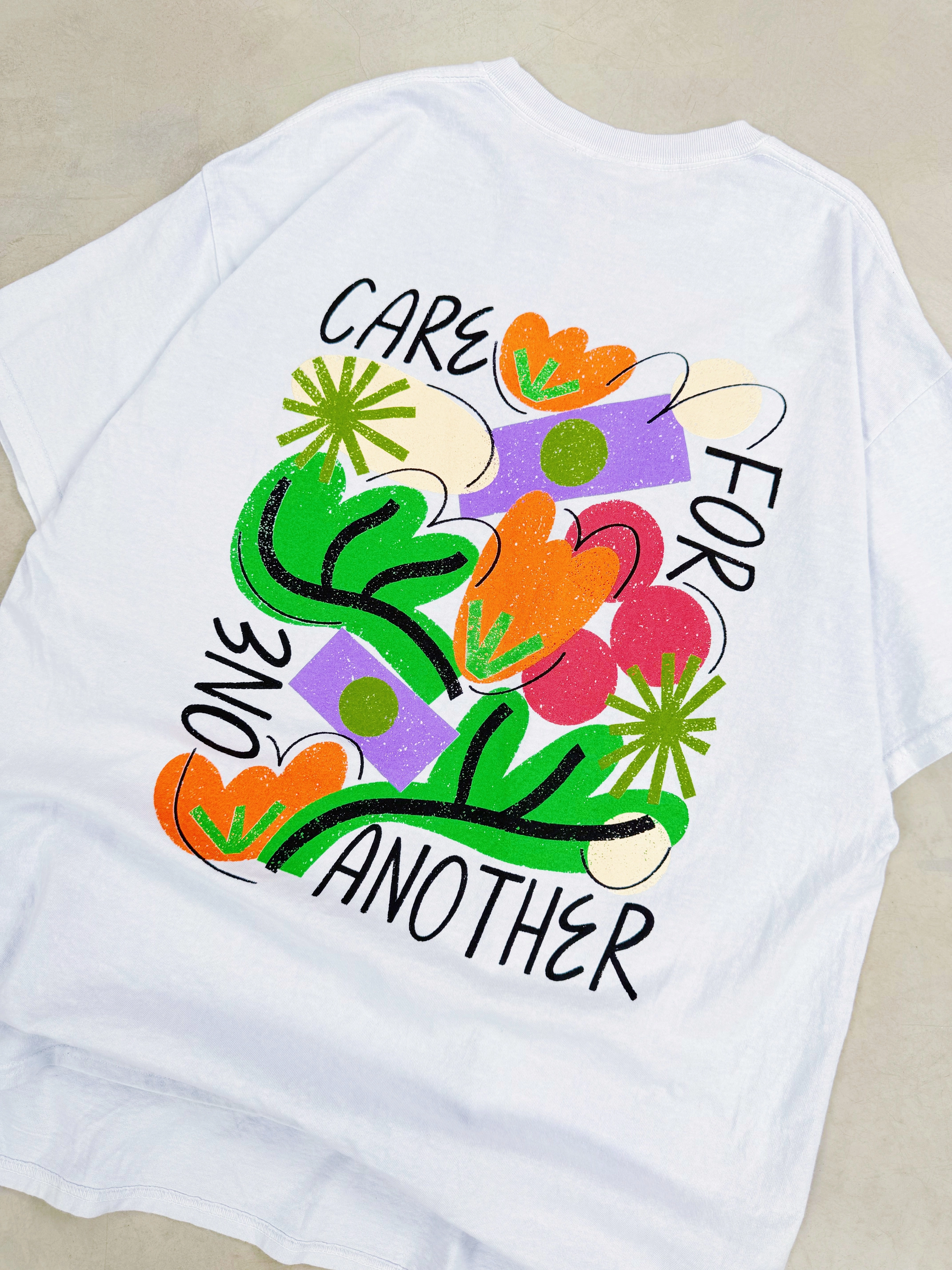 C.D x UN:IK 'Care For One Another' Washed Tee - Light Blue Versatile Top