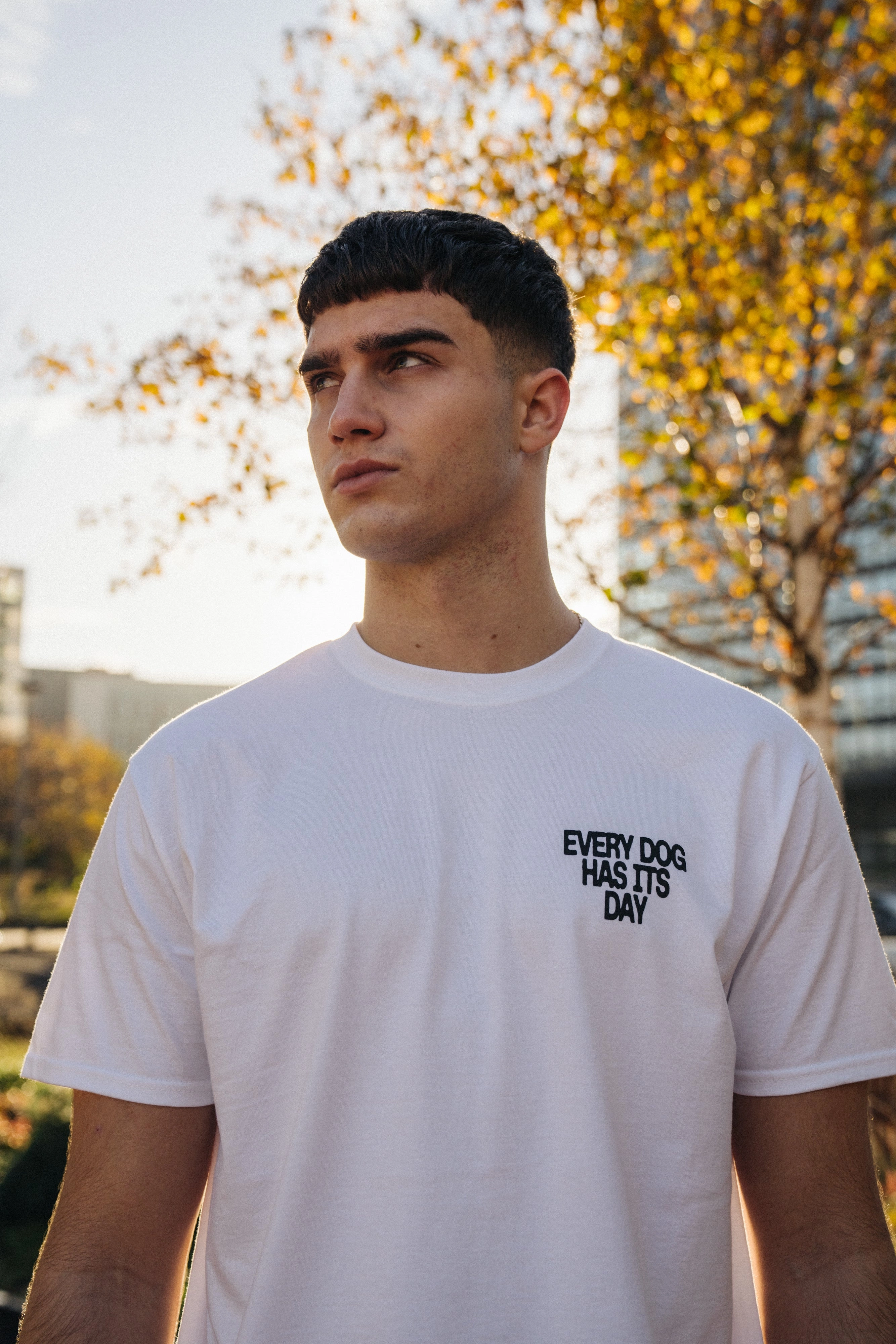 KBAR X UN:IK 'Every Dog Has Its Day' Tee - White Bright and Bold