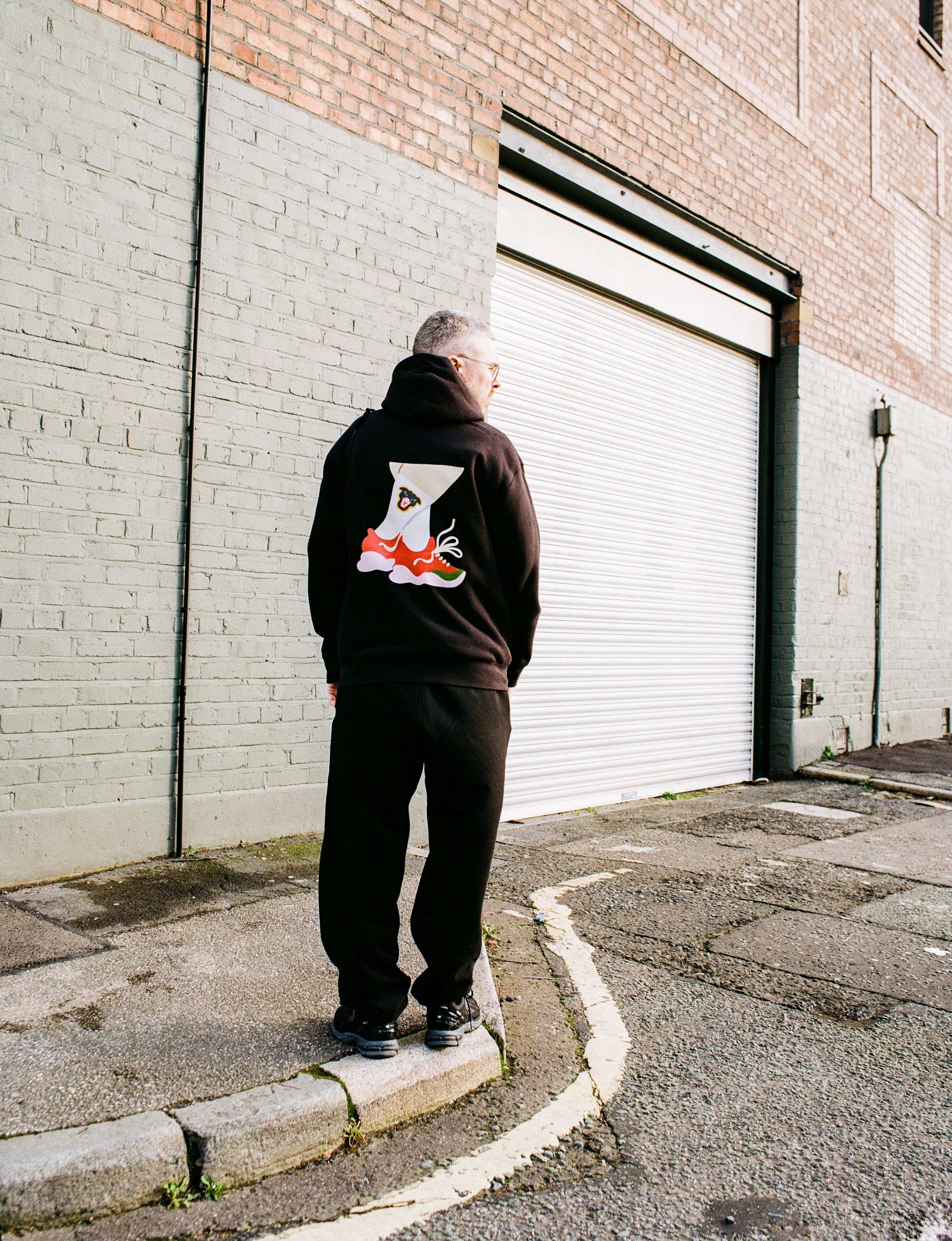 Mel?? X Club Bad 'Crossed Legs' Hoodie - Black Outdoor Motion Student Life