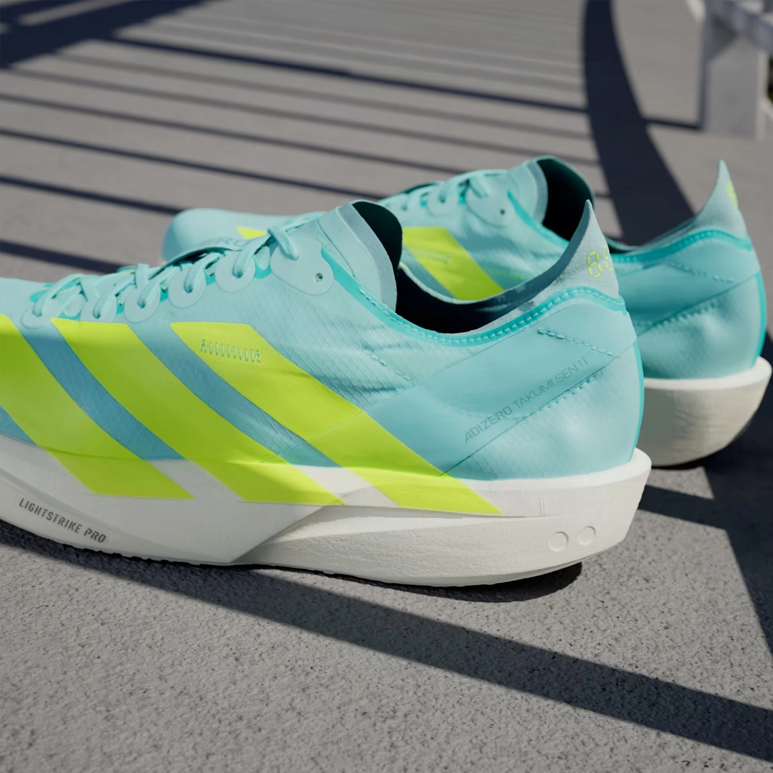 Men's Adizero Takumi Sen 11 Running Shoes Flash Aqua / Zero Metalic / Mint Ton Supportive straps pastel - colors